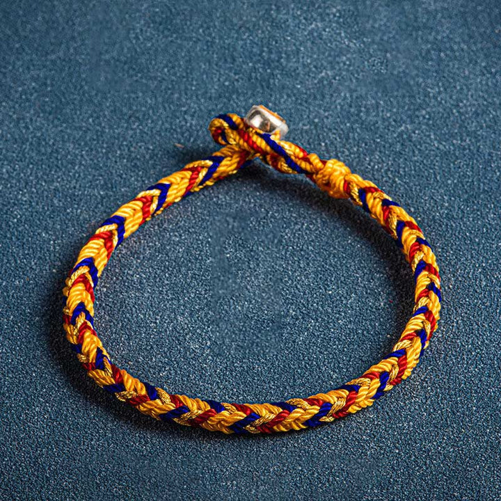 Mehrfarbiges Armband Flachlage gelb blau rot geflochten Schutz Glück Armband Mehrfarbig