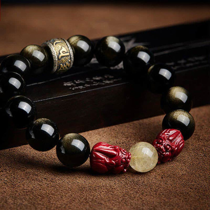 Schwarzes Obsidian Armband mit roten Zinnober Perlen und Om Symbol Schutz