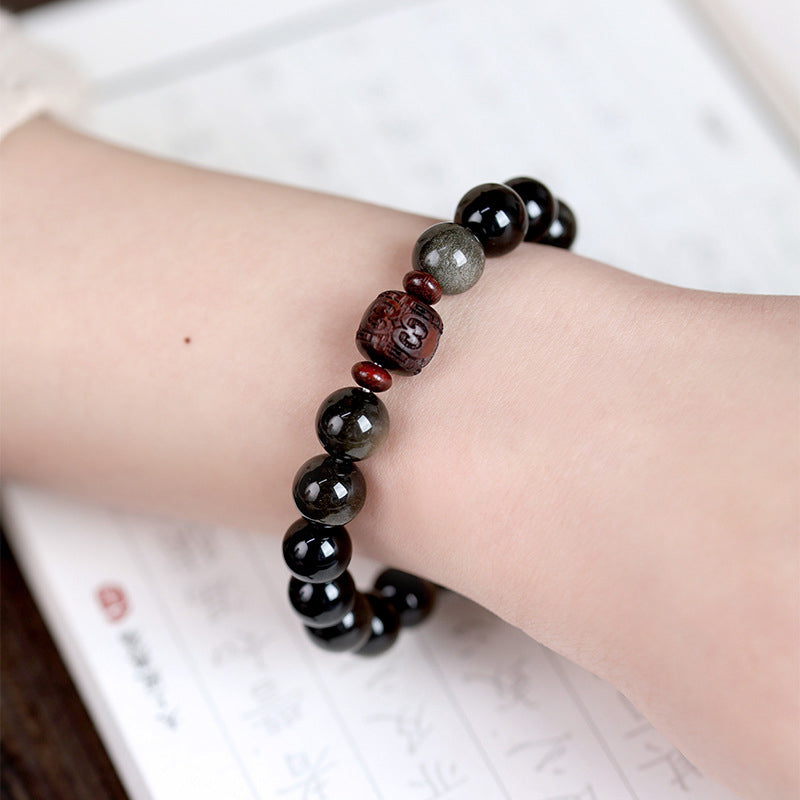 Armband Obsidian Om Mani Padme Hum schwarze Perlen Handgelenk getragen