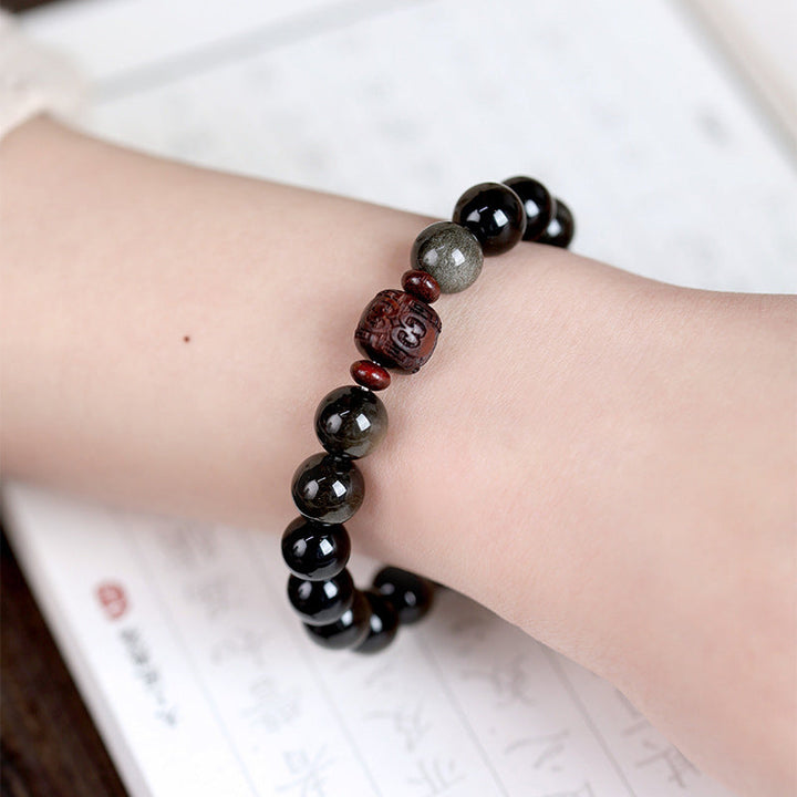 Armband Obsidian Om Mani Padme Hum schwarze Perlen Handgelenk getragen