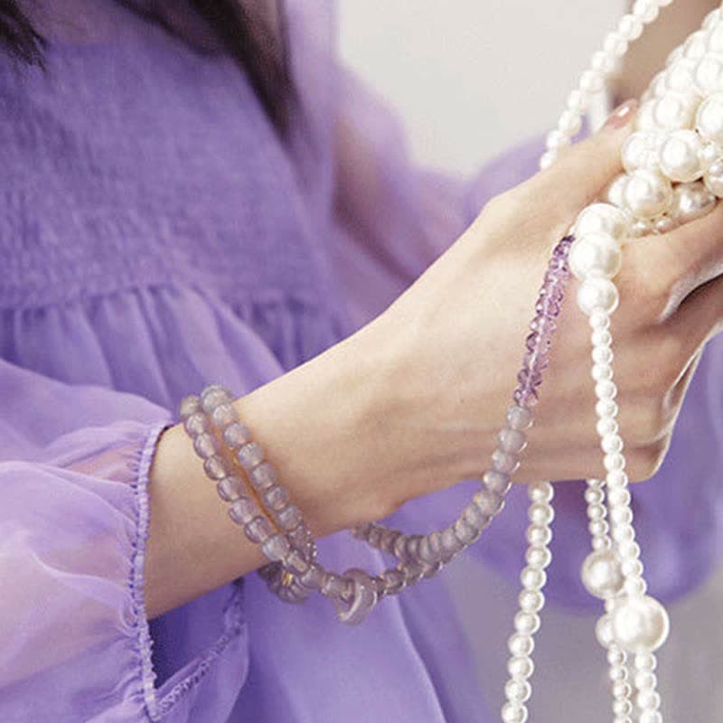 Armband Amethyst Kristall Heilung Stärke lila Perlen Handgelenk getragen