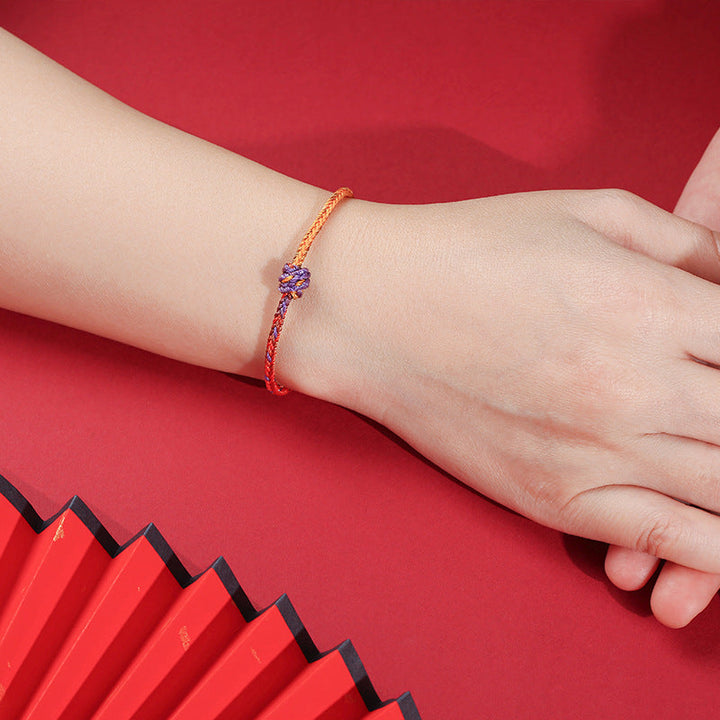 Armband Bunt Lila Gold Rot elastisch am Handgelenk getragen