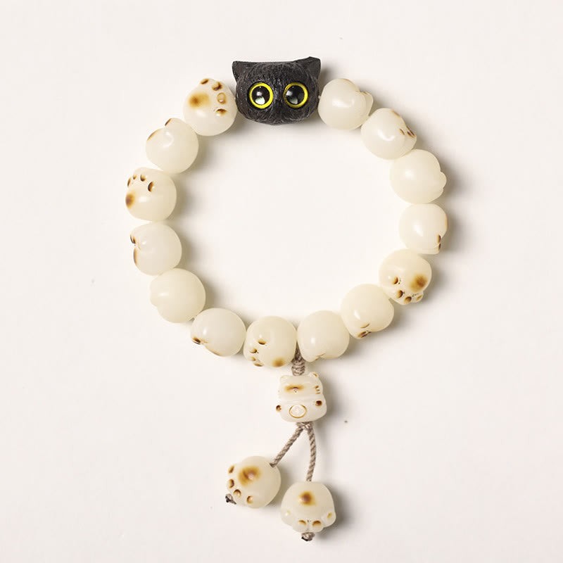 Armband Bodhi Ebenholz Katze mit cremefarbenen Perlen und Anhängern elastisch