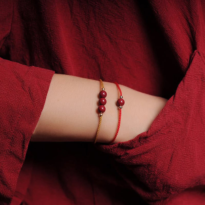 Armband Zinnober – Segen & Segen rote Perlen Goldkette Handgelenk