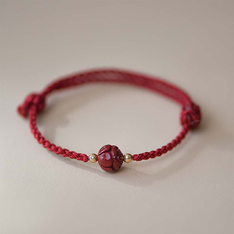 Rotes Armband Zinnober Jade Lotus mit goldfarbenen Perlen elastisch