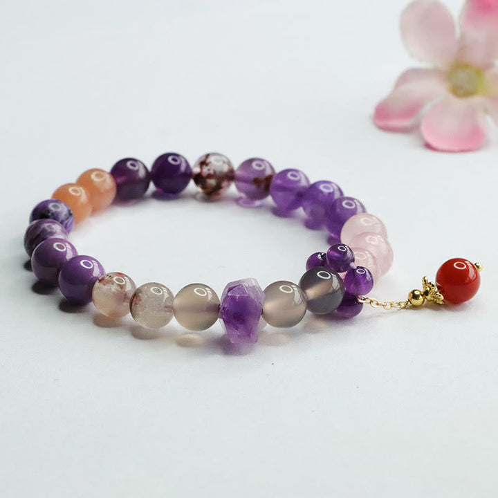 Armband Amethyst Kristall mit Perlen violett und orange Stein.
