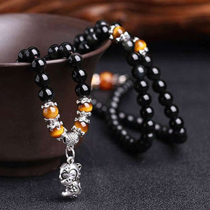 Armband Schwarzer Obsidian Tigerauge Chinesisches Tierkreis – Glück elastisch getragen
