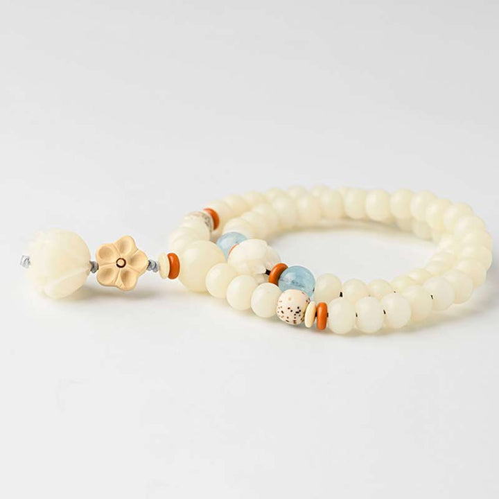 Armband Weiße Jade Bodhi Lotus Segen mit orangefarbenen Perlen elastisch