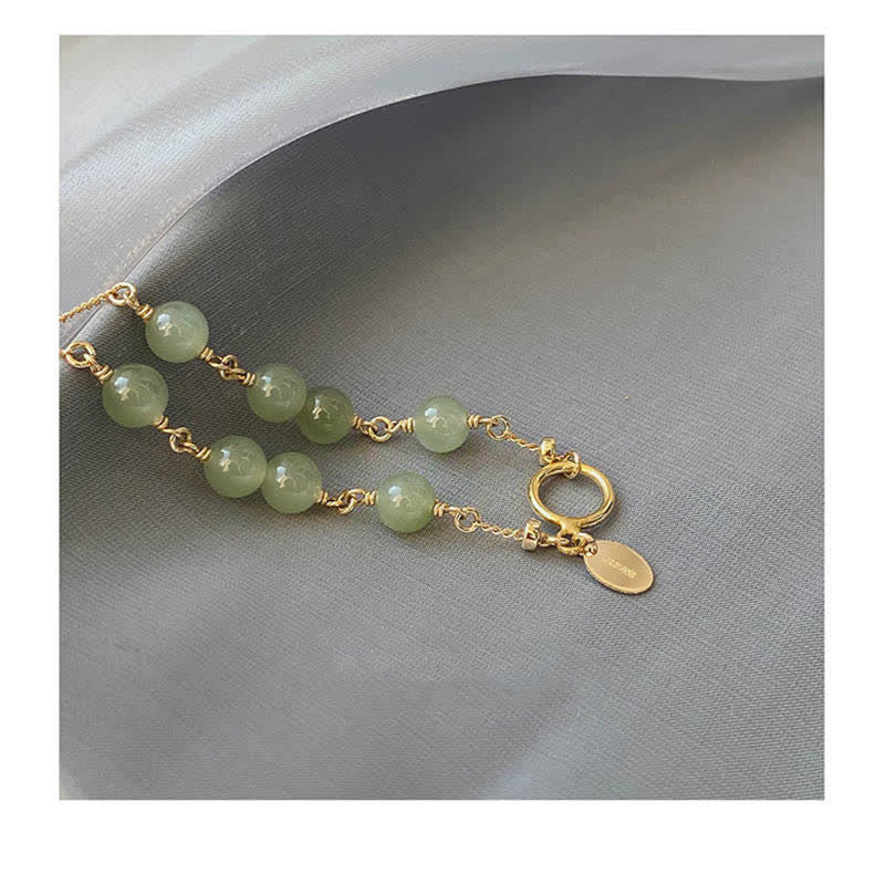 Armband Jade – Glück hellgrüne Perlen goldene Verschlüsse elegantes Design