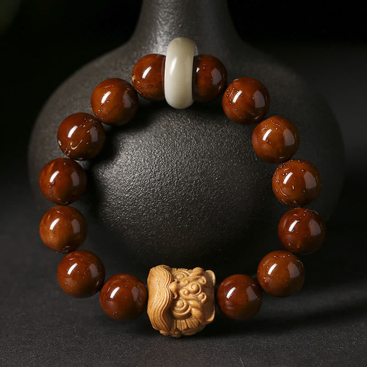 Armband mit braunen Perlen Tanzendes Löwe Bodhi Samen elastisch