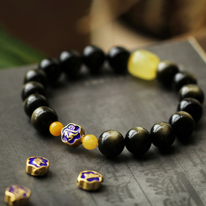 Schwarzes Obsidian Armband mit goldenen Perlen und chinesischen Symbolen elegantes Design.