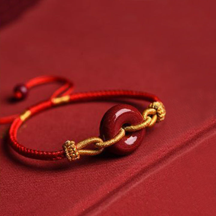 Armband Zinnober – Frieden & Segen Energie, rotes Seidenband mit goldenem Schmuck