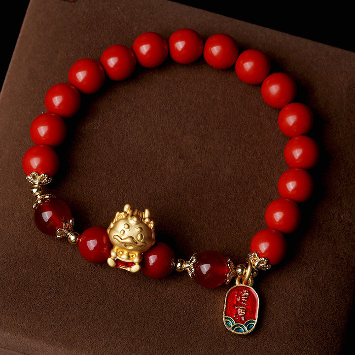 Rotes Armband Zinnober Drachen – Schutz mit goldenen Akzenten braun.