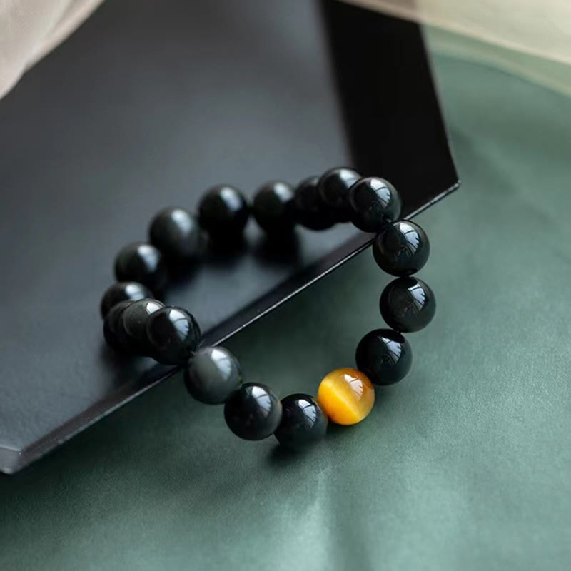 Schwarzes Obsidian Armband mit goldenem Tigerauge Stein Schmuck