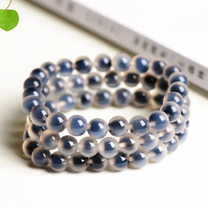 Armband Achat – Stärke & Harmonie grauer Naturstein elastisch mehrreihig getragen