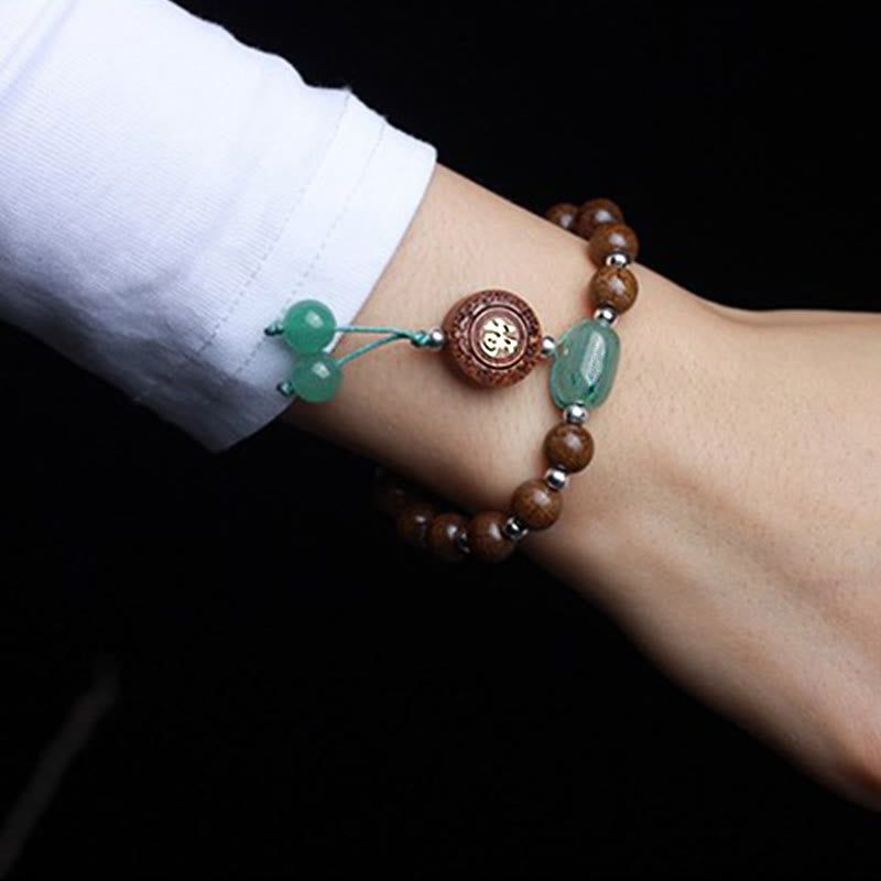 Armband – Schutz & Glück & Harmonie aus grünem Jade und braunem Holz elegant.