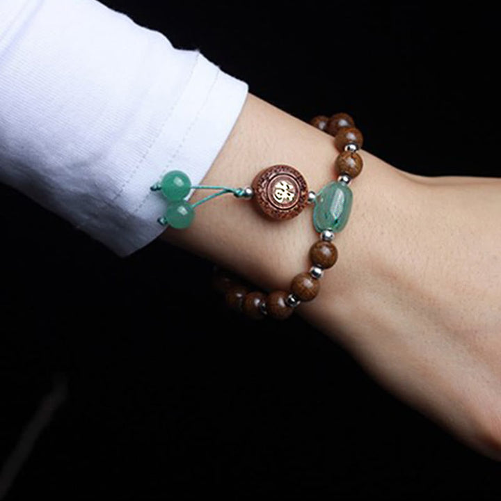 Armband – Schutz & Glück & Harmonie aus grünem Jade und braunem Holz elegant.