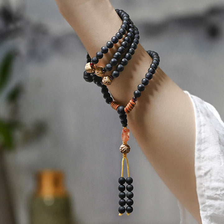 Mala Roter Achat Bodhi – Heilung am Handgelenk getragen schwarze Perlen