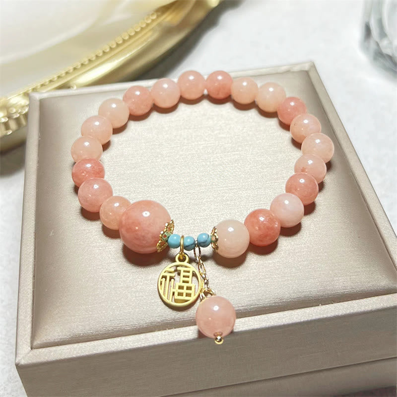 Roséquarz Armband Türkis Fu-Zeichen – Glück elegant präsentiert Schachtel