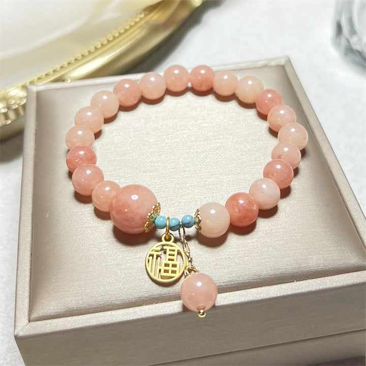 Roséquarz Armband Türkis Fu-Zeichen – Glück elegant präsentiert Schachtel