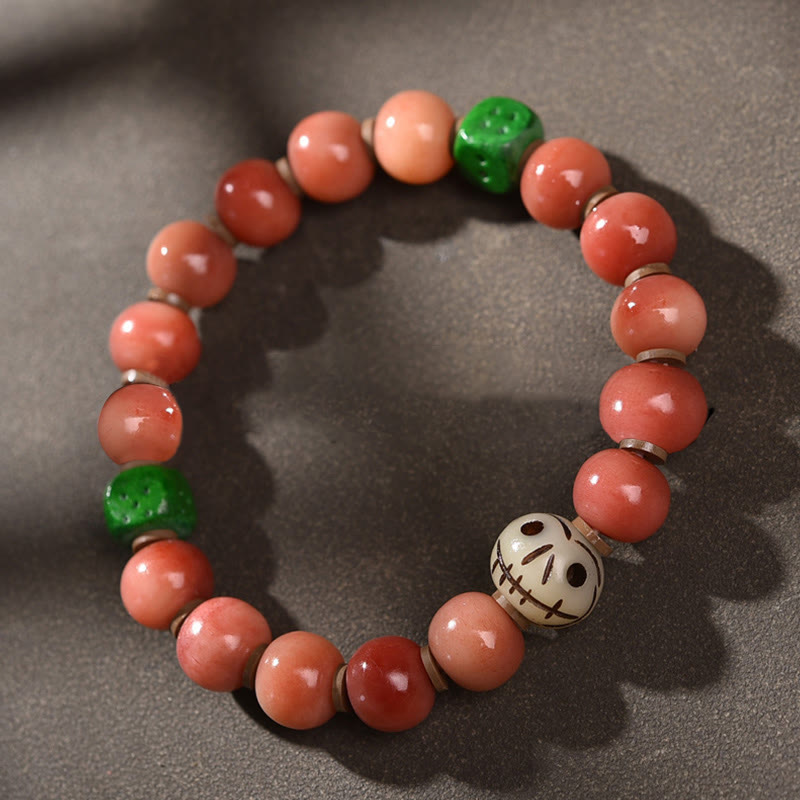 Armband Bodhi – Glück mit roten Perlen und grünen Steinen elastisch.