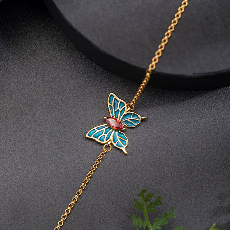 Goldenes Armband mit blauem Schmetterling Anhänger Naturstein