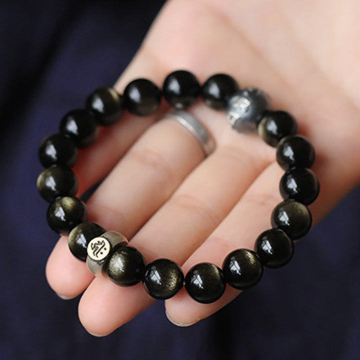 Armband Obsidian Chinesisches Tierkreis schwarze Perlen Handgelenk getragen