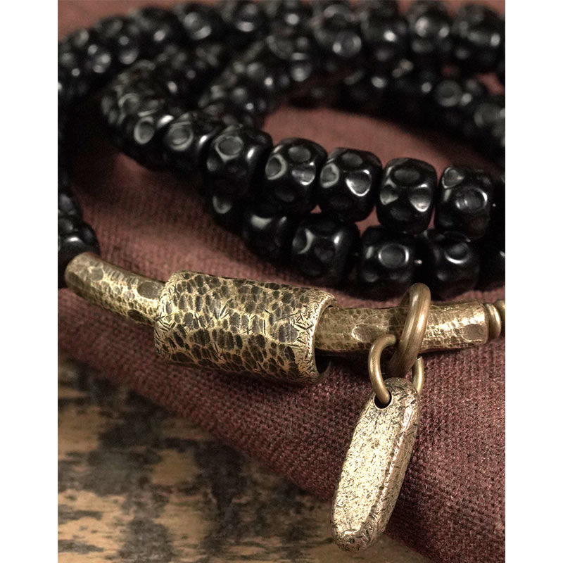 Armband Kupfer Retro Coconut mit schwarzen Perlen elastisch getragen