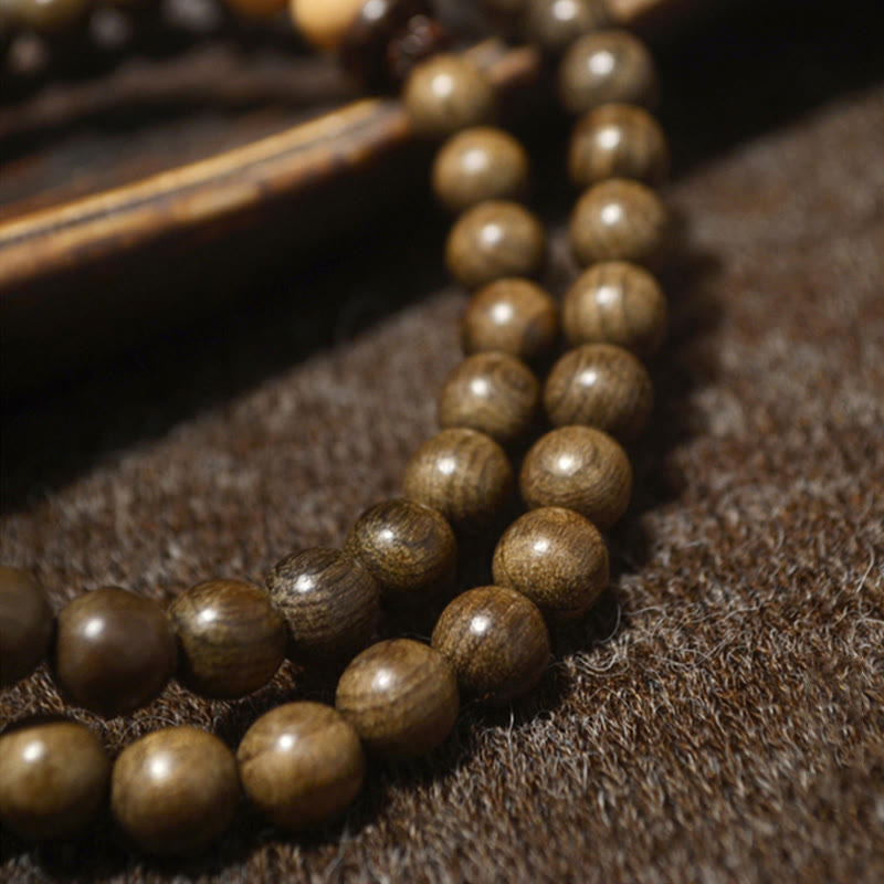 Mala Sandelholz – Schutz Perlenarmband braun glänzend Naturstein elegant