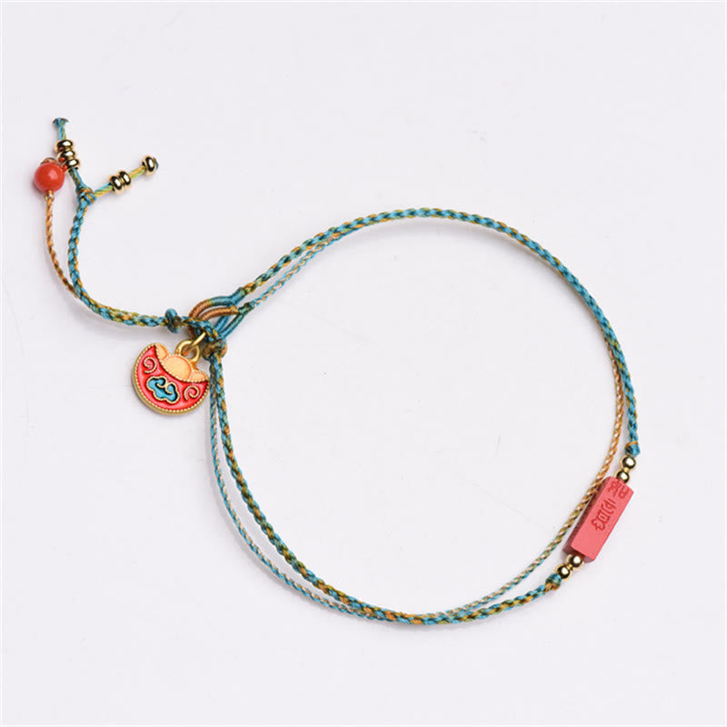Armband Zinnober – Segen & Balance buntes Seidenarmband mit Glöckchen Anhänger