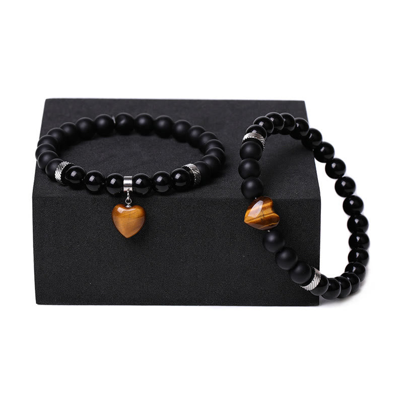 Armband Schwarzer Onyx Kristall Paar mit goldenem Herz Anhänger.