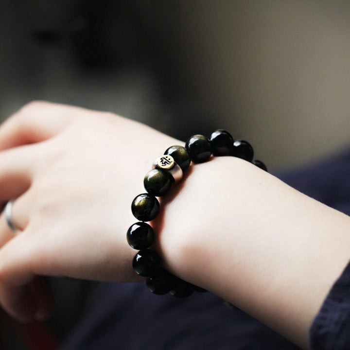 Armband Obsidian Chinesisches Tierkreis schwarze Perlen Handgelenk getragen