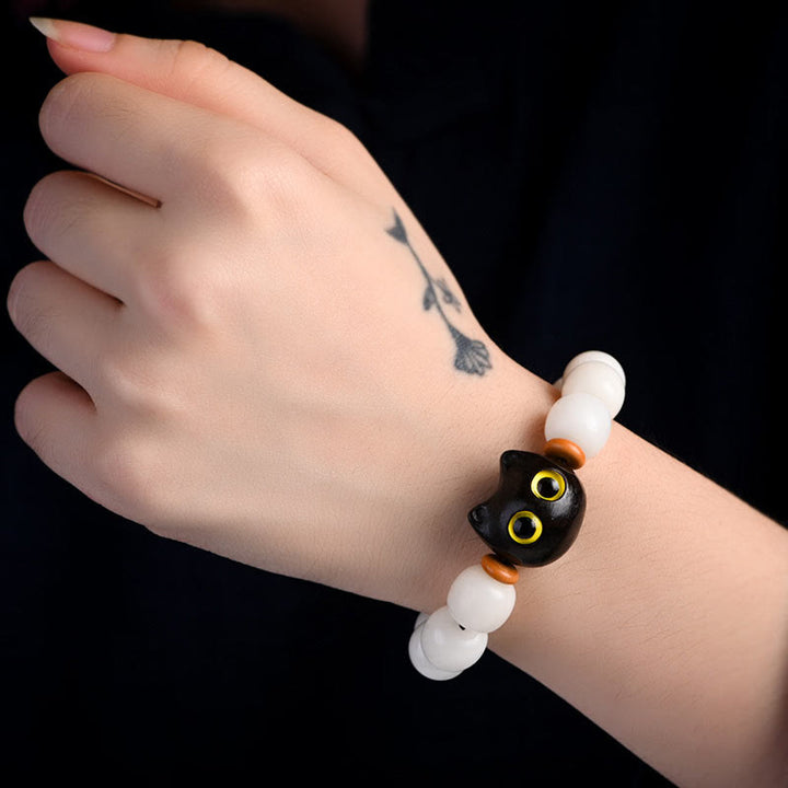 Armband Sandelholz Bodhi Katze Glück schwarze Katze weiße Perlen elastisch