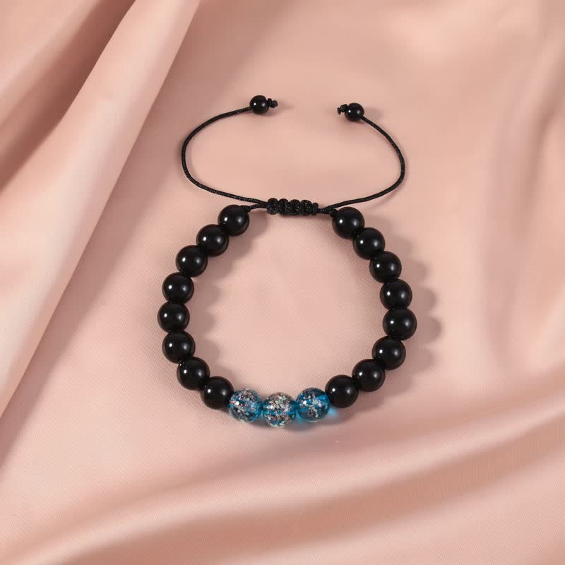 Armband Schwarzer Obsidian – Stärke mit blauen Kristallperlen elegant.