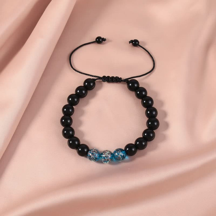 Armband Schwarzer Obsidian – Stärke mit blauen Kristallperlen elegant.
