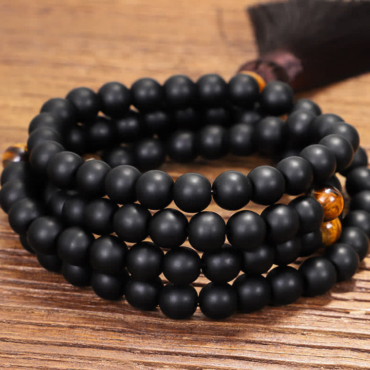 Mala 108 Perlen Tigerauge Balance schwarze Perlen Holzuntergrund Armband
