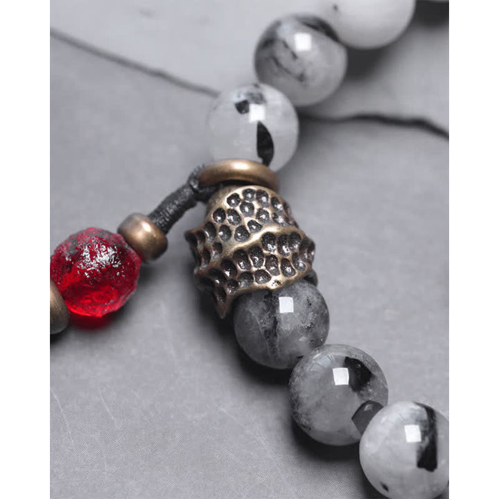 Armband mit weißem Kristall, Ebenholz und roten Akzenten elegant.
