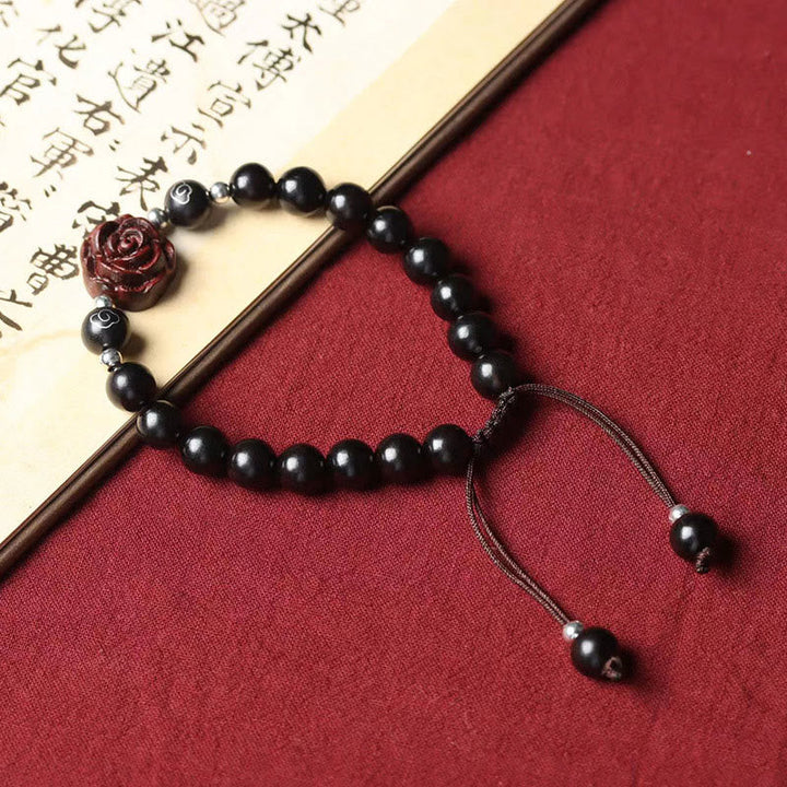 Schwarzes Perlen Armband mit roter Rose Charm Sandelholz elegant