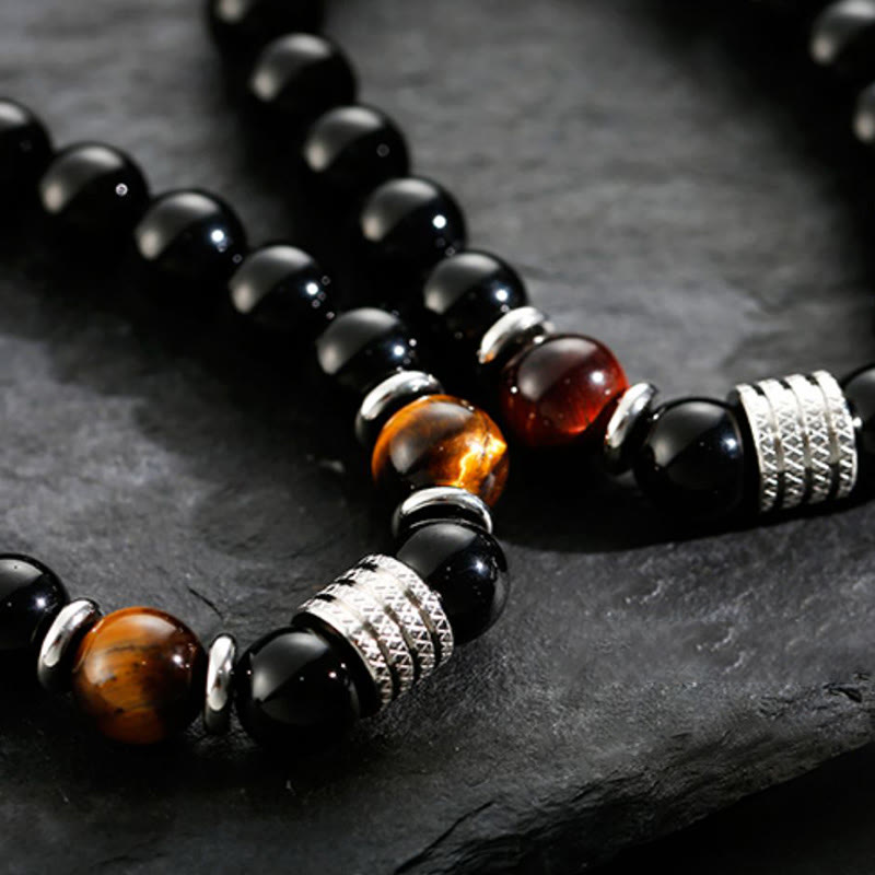 Armband Schwarzer Obsidian Tigerauge – Stärke mit Metallverzierungen elegant.