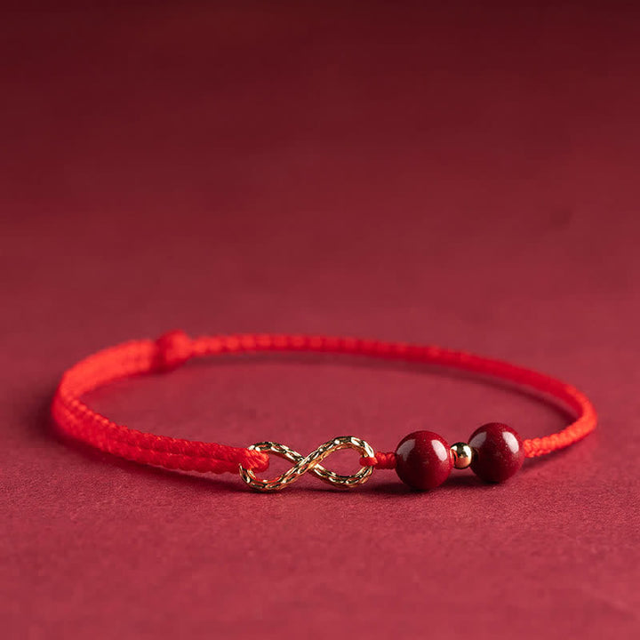 Armband Rotes Band Gold Infinity Symbol