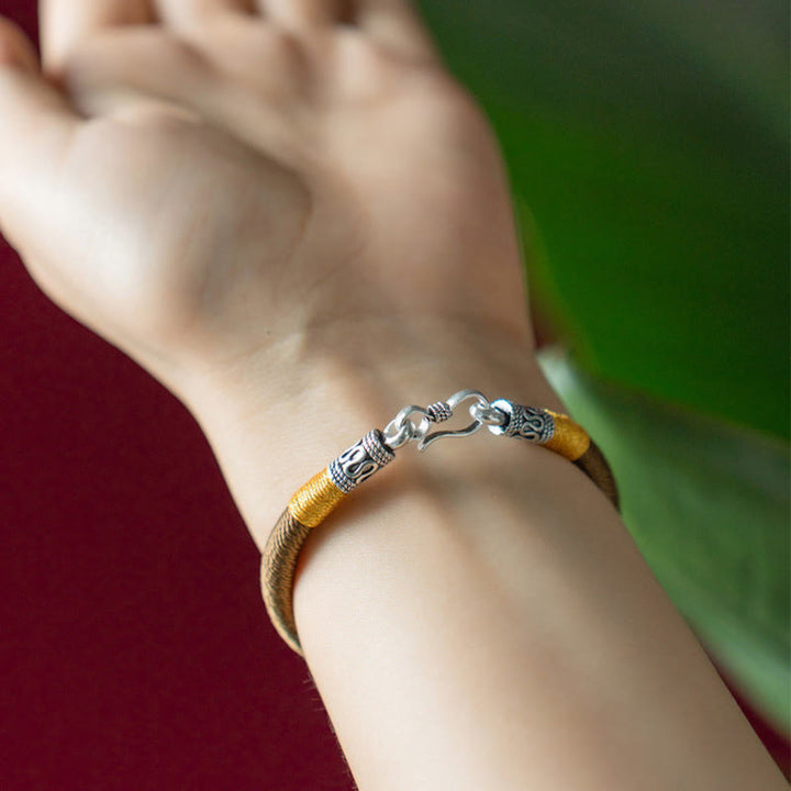 Armband – Schutz & Glück Stärke goldenes Wickelarmband Silberverschluss elegant