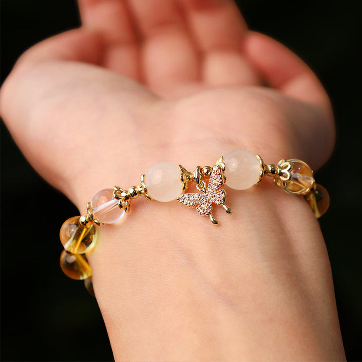 Armband Mondstein Citrin Schmetterling Gold Perlen elegant Handgelenk getragen