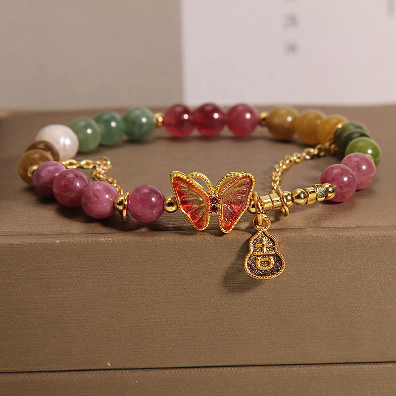 Armband Schmetterling – Energie mit bunten Natursteinen und goldenem Schmuck.