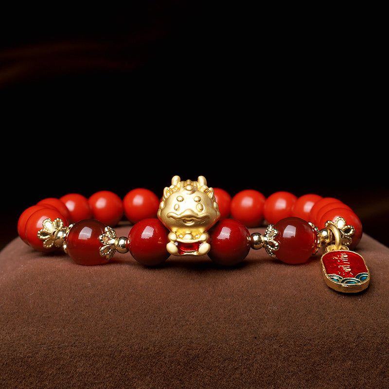 Armband Zinnober Drachen – Schutz goldene Perlen rotes Glasperlen elastisch.
