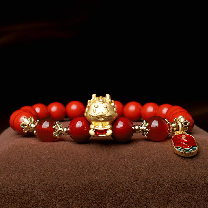 Armband Zinnober Drachen – Schutz goldene Perlen rotes Glasperlen elastisch.