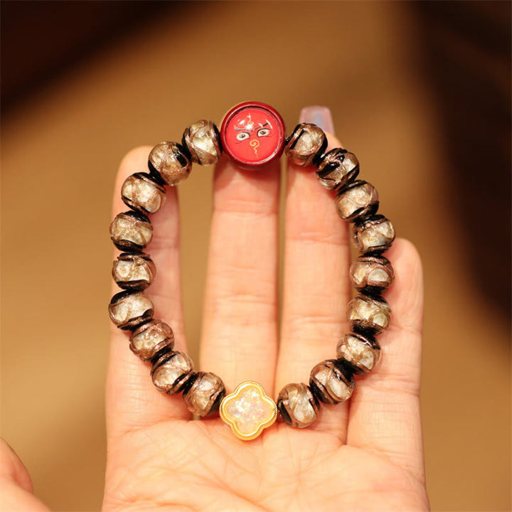 Armband – Wohlstand & Glück mit goldenen Perlen und roten Anhängern