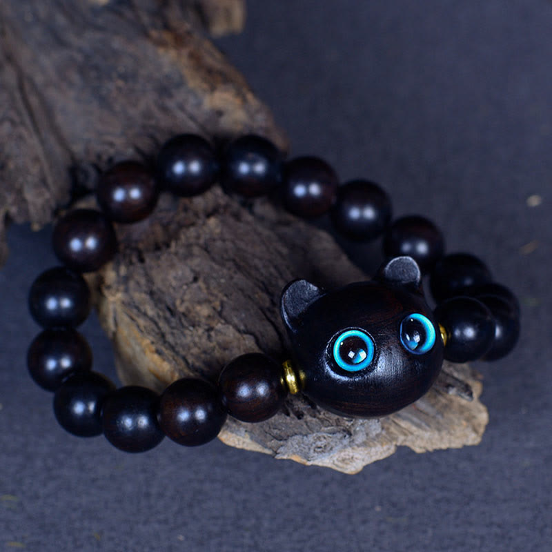 Schwarzes Ebenholz Katzen Armband mit blauen Augen Naturstein elastisch