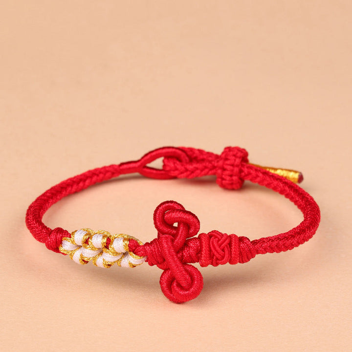 Rotes Armband – Glück & Stärke & Balance mit goldenen Perlen Knoten