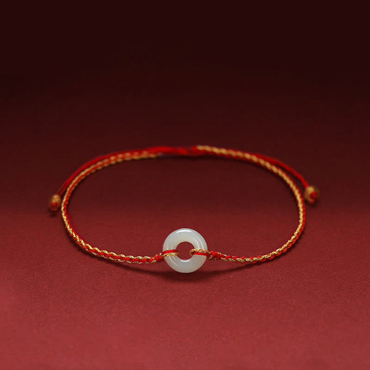 Armband Jade Glück Frieden rotes Seidenband weißer Stein elegant