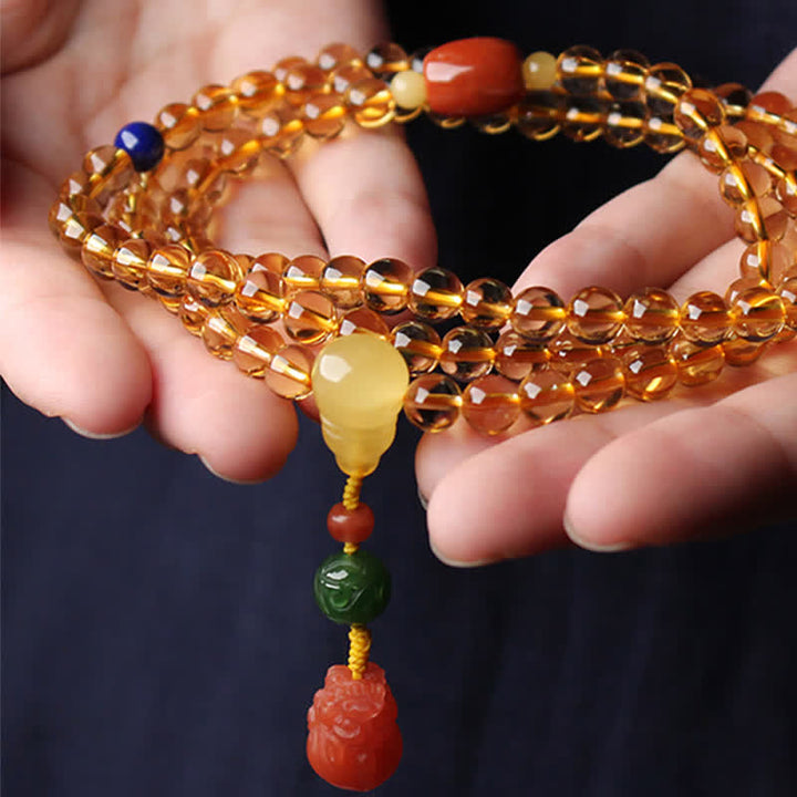 Armband Roter Achat Citrin Pixiu am Handgelenk Schutz Frieden getragen